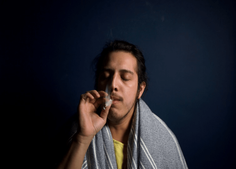 a man smoking cannabis
