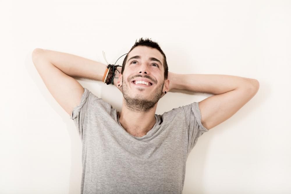 Relaxed man smiling happily